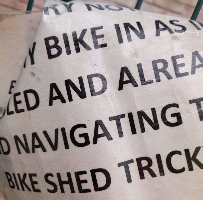 Sign in bike shed asking for disabled bike not to be blocked