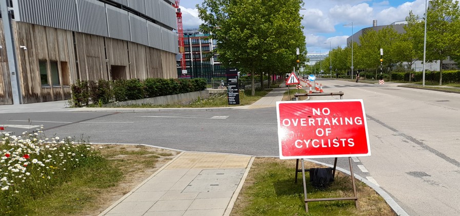 No overtaking of cyclists sign outside the AstraZeneca travel hub
